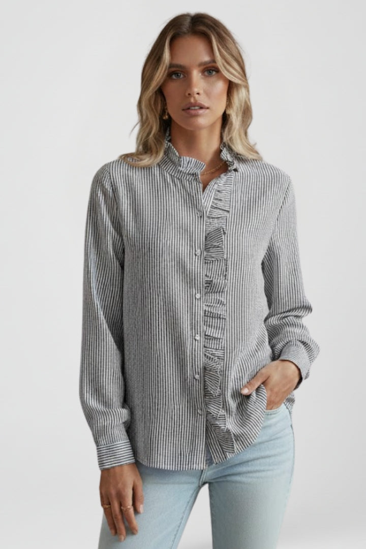 Grey long-sleeve blouse with ruffled placket and buttoned front