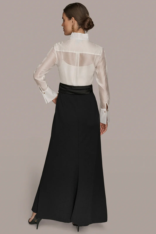 Tuxedo wrap gown back view: cream sheer high collar, black long skirt.